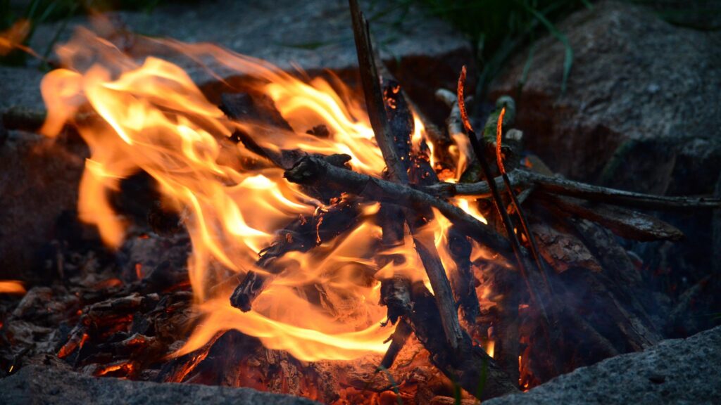 Crackling Campfire Embers at Dusk 4K Desktop Wallpaper