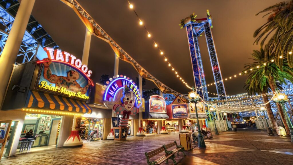 Nighttime Boardwalk Amusement Park Pier Scene 4K Wallpaper