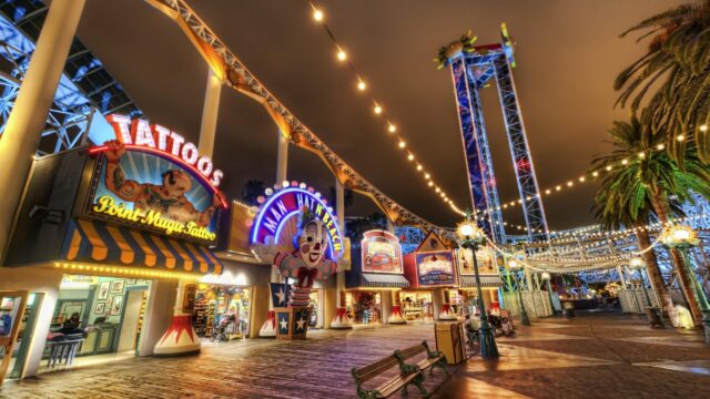 Nighttime Boardwalk Amusement Park Pier Scene 4K Wallpaper