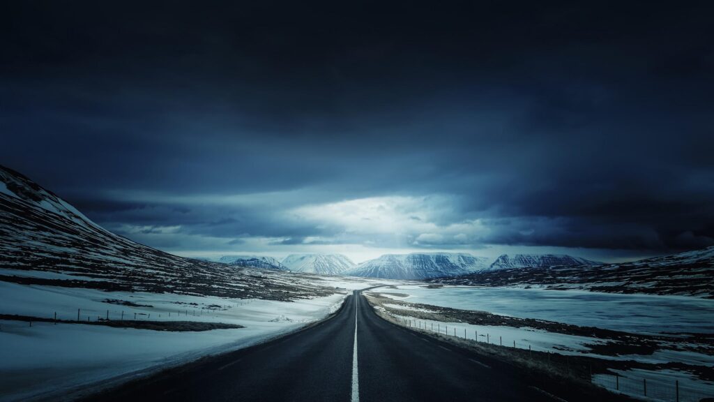 Stunning Icelandic Road Through Snowy Mountain Landscape 4K Desktop Wallpaper