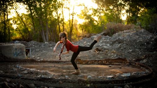 Girl Playing Violin in Golden Hour Sunlight Desktop Wallpaper