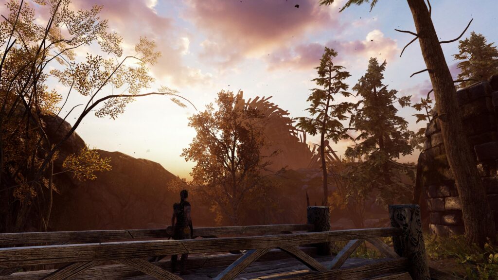 Senua from Hellblade Senuas Sacrifice Standing on a Bridge at Sunset 4K Wallpaper