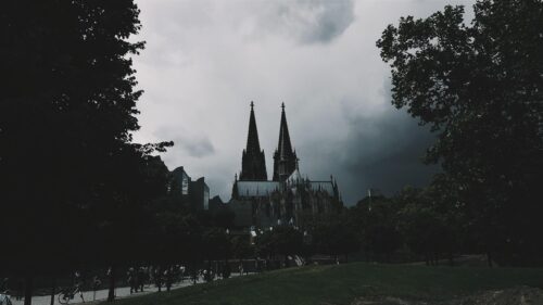 Cologne Cathedral Under Ominous Stormy Skies Desktop Wallpaper