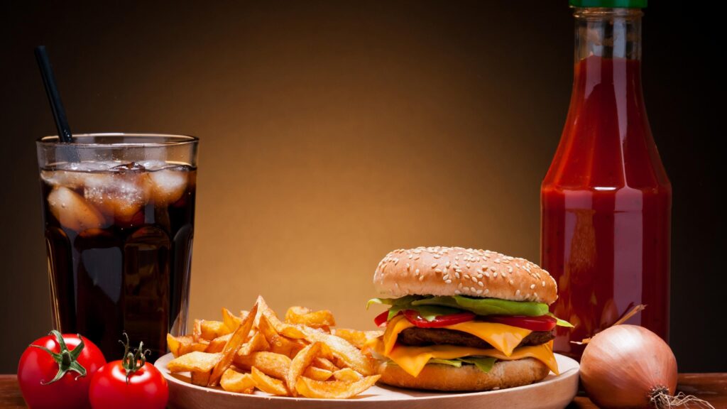 Delicious Gourmet Cheeseburger with Fries and Cola Desktop Wallpaper