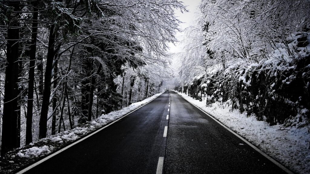 Stunning Snowy Mountain Road Through Winter Forest Desktop Wallpaper