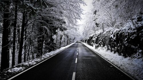Stunning Snowy Mountain Road Through Winter Forest Desktop Wallpaper