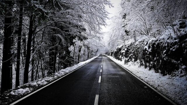 Stunning Snowy Mountain Road Through Winter Forest Desktop Wallpaper