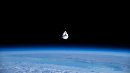 SpaceX Crew Dragon Capsule Floating Above Earth 4K Desktop Wallpaper