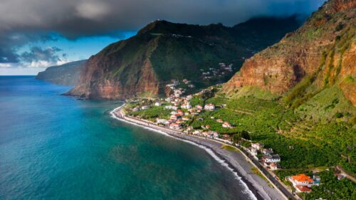 Stunning Coastal Village Under Dramatic Skies in Madeira Portugal 4K Wallpaper