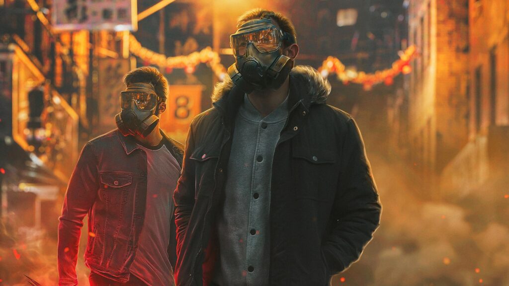 Two Men in Gas Masks Walking Through a Smoky Urban Street 4K Desktop Wallpaper