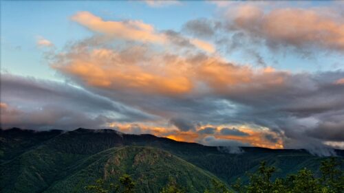 Stunning Mountain Ridge Under Golden Sunset Clouds Desktop Wallpaper