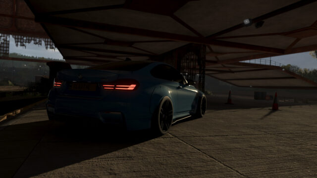 Stunning Modified BMW M4 Coupe Parked Under Industrial Structure PC Wallpaper