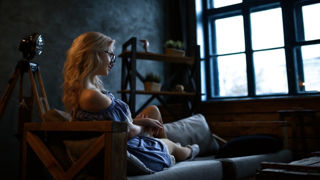 Woman Relaxing in Cozy Minimalist Living Room PC Wallpaper
