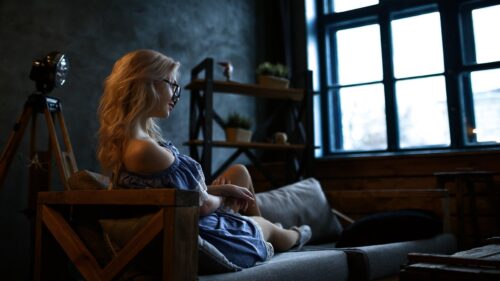 Woman Relaxing in Cozy Minimalist Living Room PC Wallpaper