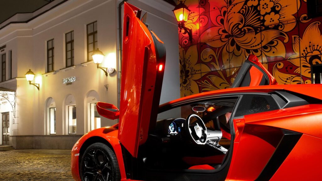 Stunning Orange Lamborghini Aventador with Scissor Doors at Night Desktop Wallpaper