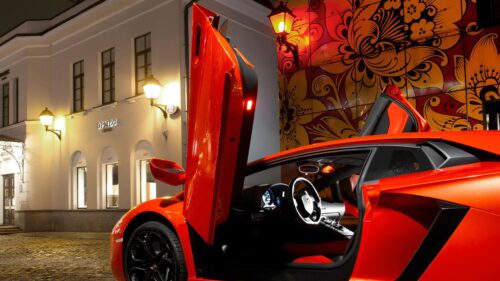 Stunning Orange Lamborghini Aventador with Scissor Doors at Night Desktop Wallpaper