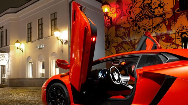 Stunning Orange Lamborghini Aventador with Scissor Doors at Night Desktop Wallpaper
