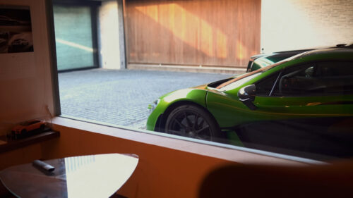 Stunning Lime Green McLaren P1 Supercar Parked in Modern Garage 4K Wallpaper
