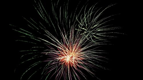 Stunning Green and Red Firework Burst Night Sky 4K Desktop Wallpaper