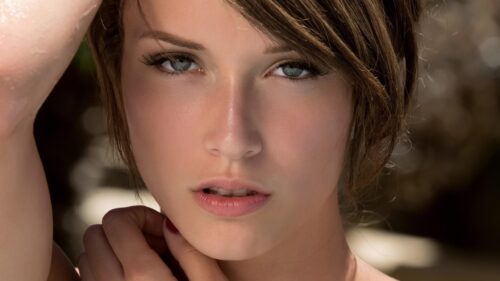 Stunning Portrait of a Beautiful Woman with Piercing Eyes 4K PC Wallpaper