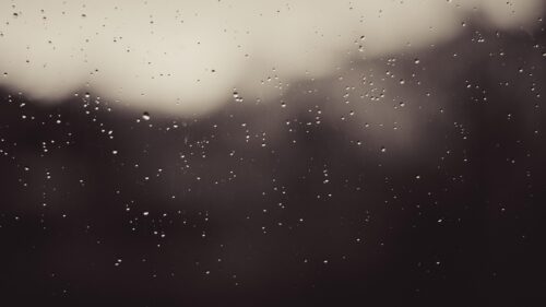 Melancholic Raindrops on Window Glass Dark Aesthetic Desktop Wallpaper