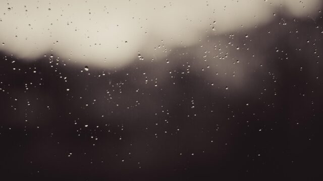 Melancholic Raindrops on Window Glass Dark Aesthetic Desktop Wallpaper