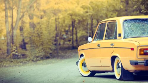 Vintage Yellow Classic Car on Autumn Road Desktop Wallpaper
