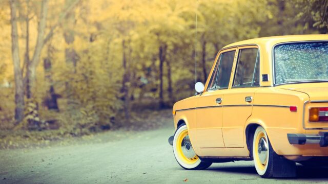 Vintage Yellow Classic Car on Autumn Road Desktop Wallpaper