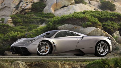 Stunning Pagani Huayra Hypercar in Rocky Mountain Landscape Desktop Wallpaper