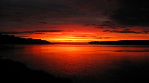 Fiery Sunset Over Calm Lake Landscape 4K Desktop Wallpaper