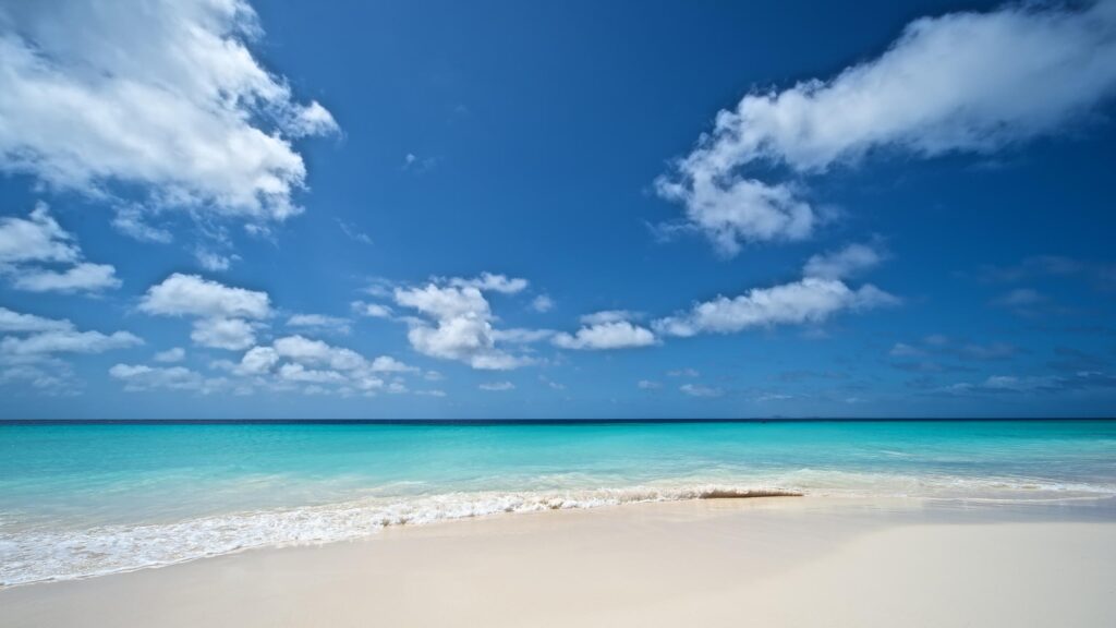 Stunning Tropical Beach with Turquoise Water and Clear Blue Sky PC Wallpaper