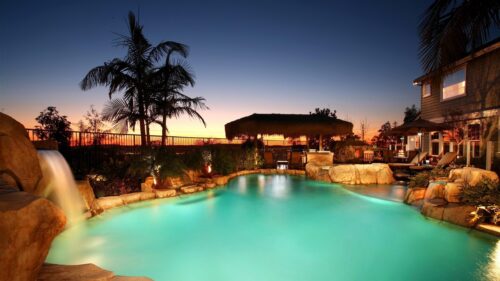 Luxurious Backyard Swimming Pool at Sunset 4K Desktop Wallpaper