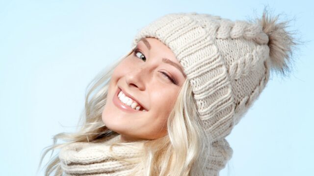 Beautiful Blonde Woman in Winter Knitted Hat and Scarf Desktop Wallpaper
