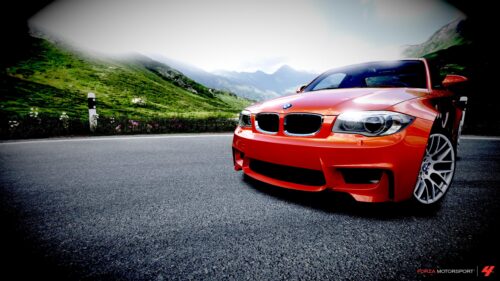 Orange BMW 1 Series M Coupe parked on a Mountain Road 4K Desktop Wallpaper
