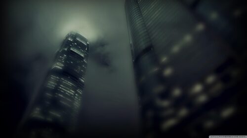 Stunning Hong Kong Skyscrapers in Foggy Night Sky Desktop Wallpaper