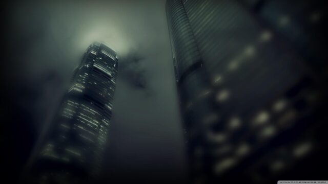 Stunning Hong Kong Skyscrapers in Foggy Night Sky Desktop Wallpaper