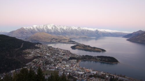 Stunning Aerial View of Queenstown and The Remarkables Snow-Capped Mountains Desktop Wallpaper