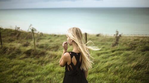 Blonde Woman Standing by the Coastline Scenic Nature View Desktop Wallpaper