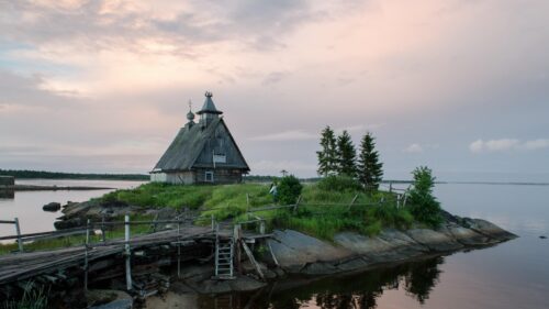 Rustic Wooden Church on Remote Island Serene Twilight Desktop Wallpaper