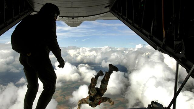 Military Paratrooper Mid-Air Jump from C-130 Aircraft 4K Desktop Wallpaper
