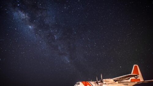 US Coast Guard C-130 Hercules Under Milky Way Starry Night Sky 4K Wallpaper