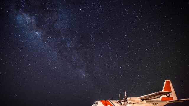 US Coast Guard C-130 Hercules Under Milky Way Starry Night Sky 4K Wallpaper