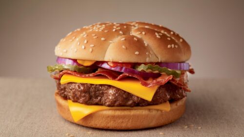 Delicious Gourmet Cheeseburger with Bacon and Fresh Toppings PC Wallpaper