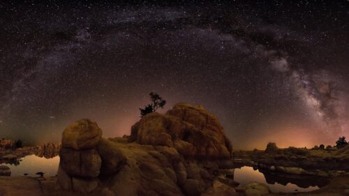 Milky Way Galaxy Above Rocky Desert Landscape 4K Desktop Wallpaper
