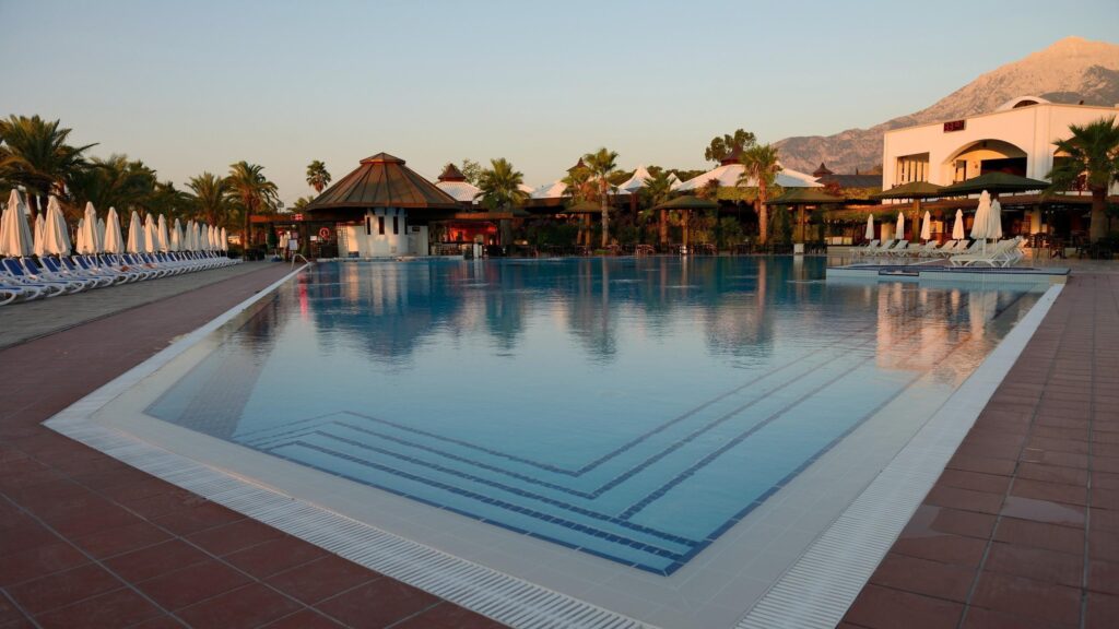 Stunning Luxury Resort Swimming Pool at Sunset 4K Wallpaper