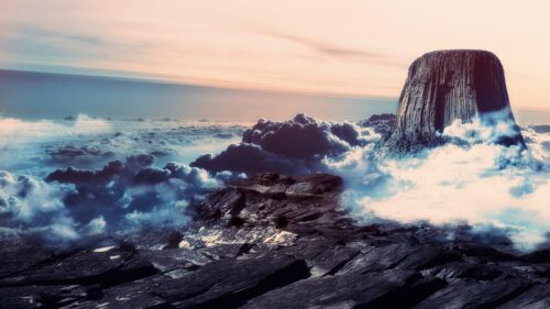 Majestic Devils Tower Above the Clouds at Sunset 4K Desktop Wallpaper