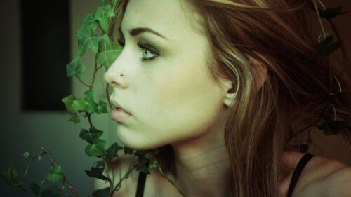 Stunning Portrait of a Woman with Natural Ivy Foliage Aesthetic 4K Wallpaper