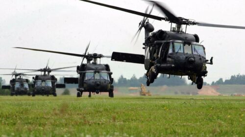 Military UH-60 Black Hawk Helicopters Landing in Formation 4K Wallpaper