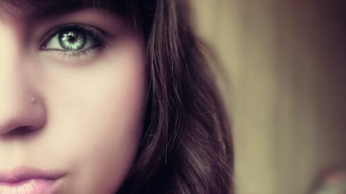 Stunning Close Up Portrait of a Woman with Emerald Green Eyes Desktop Wallpaper