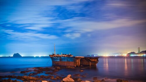 Abandoned Shipwreck at Night Under a Deep Blue Twilight Sky 4K Wallpaper